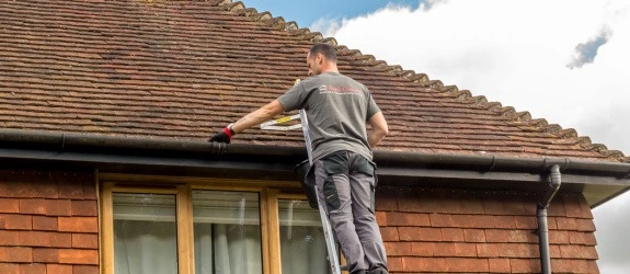 our team cleaning the gutters on a house in Stoke Bishop, Dorset